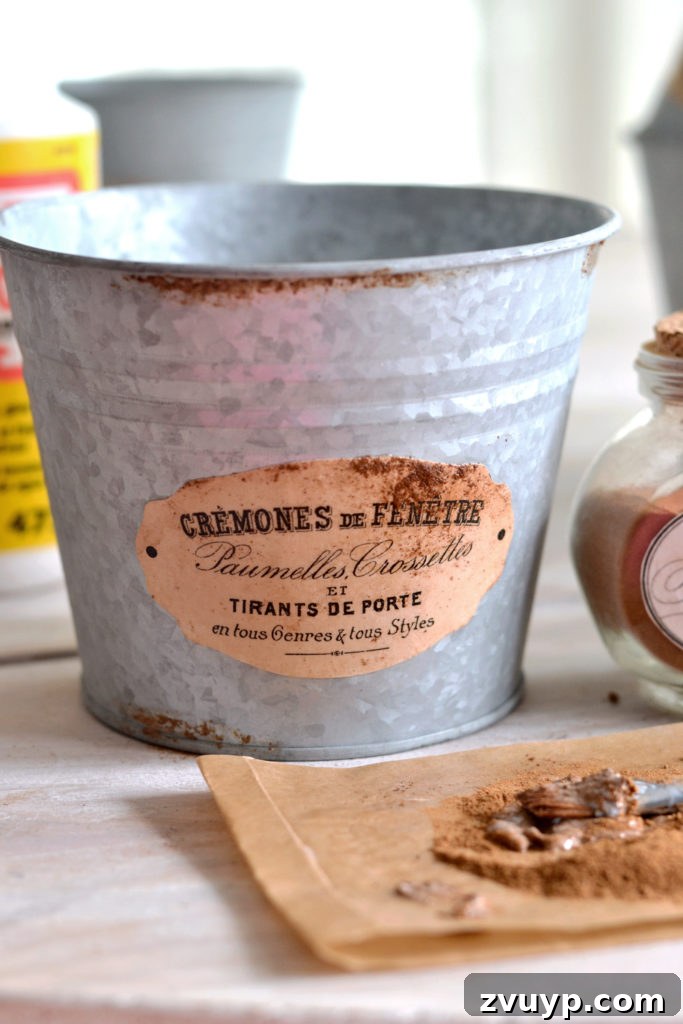 Distressed Rust Pot Makeover 7 Galvanized pots with subtle faux rust labels