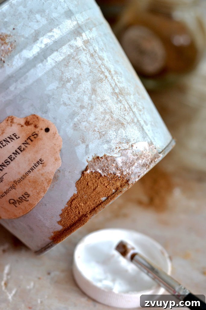 Distressed Rust Pot Makeover 9 Sealing faux rust with Mod Podge on galvanized pots