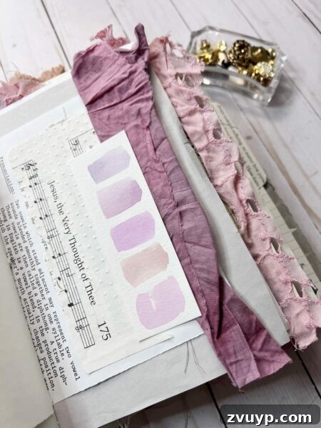 Ingrid Carlsen's Petal & Sip Junk Journal 8 Junk journal spread featuring pink watercolor swatches, layered paper, and delicate vintage elements