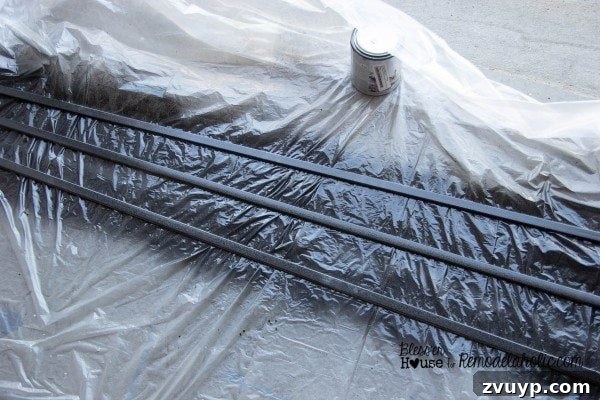 Moulding pieces drying after being spray painted black, ready for installation.