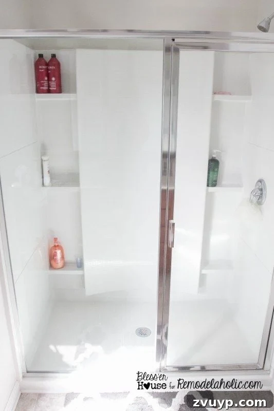 Before shot of a builder basic glass shower door, ready for an industrial factory window transformation.