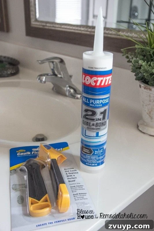 Applying clear latex caulk to seal the edges of the installed moulding on the shower door.