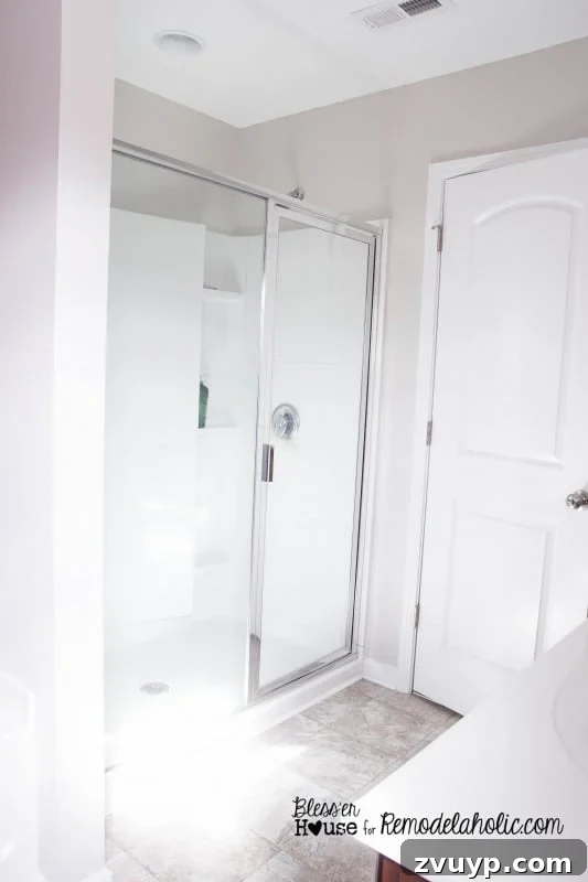 Cleaning a shower door for DIY industrial factory window transformation.