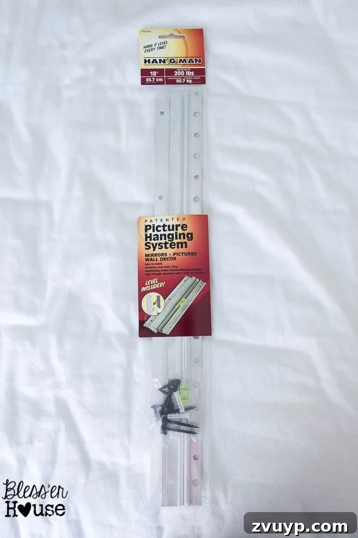 Your Guide to Building a DIY Ballet Barre and Securely Hanging Heavy Mirrors 3 Olivia Helping Attach Hangman Plate to Mirror