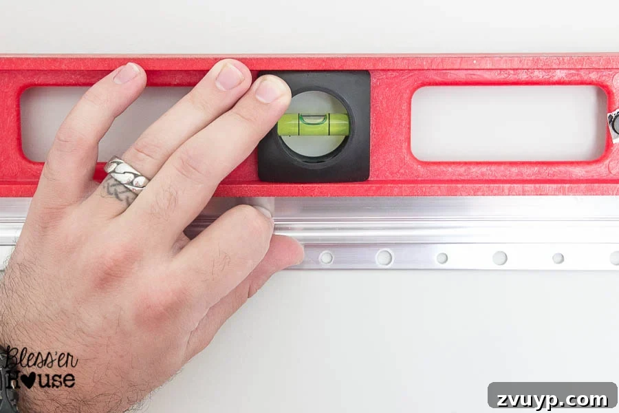 Your Guide to Building a DIY Ballet Barre and Securely Hanging Heavy Mirrors 6 Close-up of Hangman Wall Plate Installed on Studs