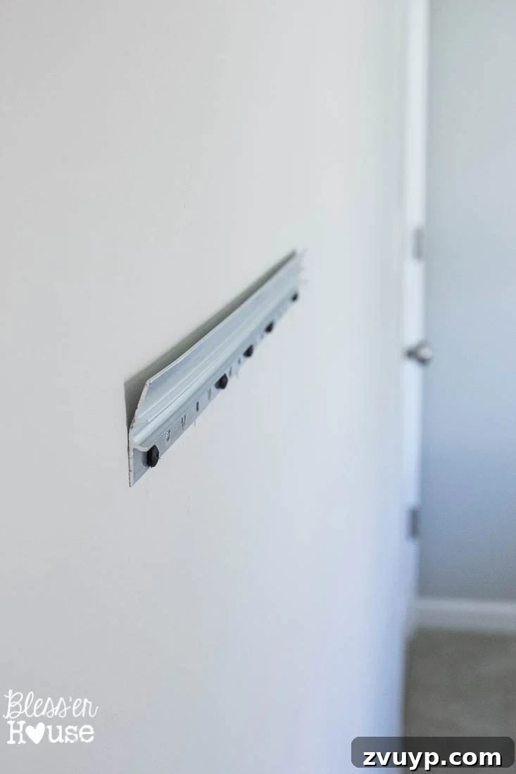 Your Guide to Building a DIY Ballet Barre and Securely Hanging Heavy Mirrors 8 Author Admiring the Securely Hung Mirror
