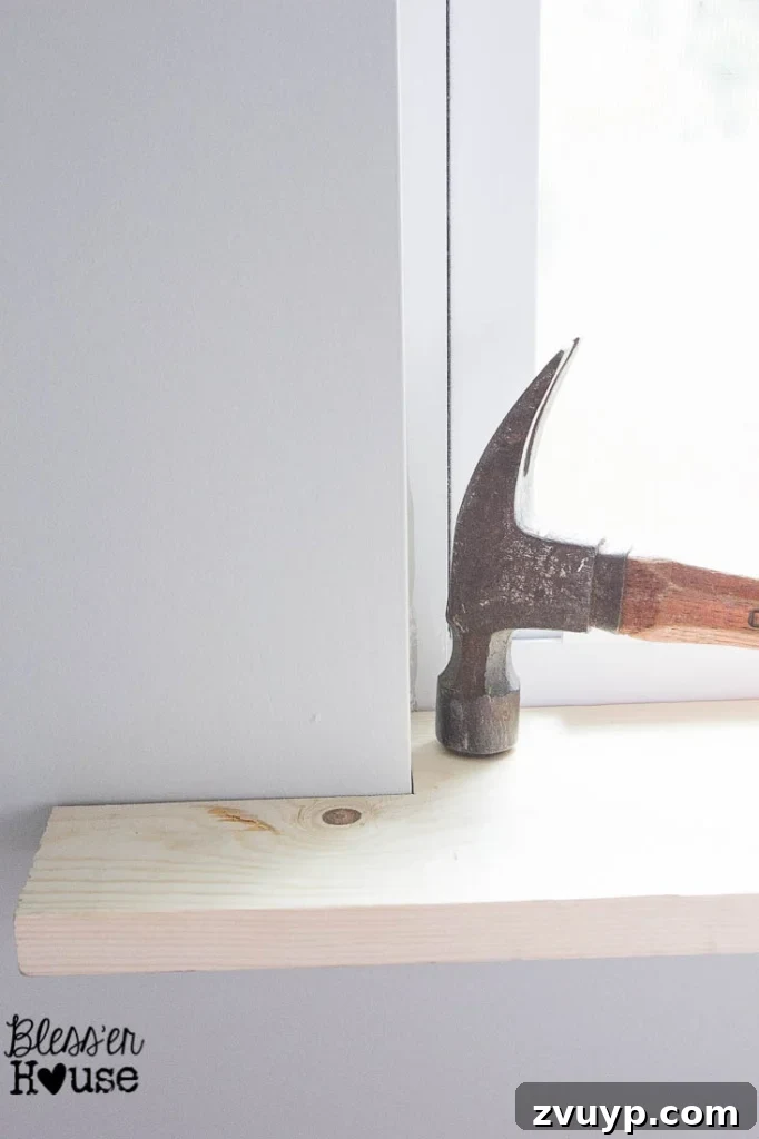 Easy Window Trim Installation: Skip the Miter Saw 6 setting a sill for window casing using a basic piece of lumber