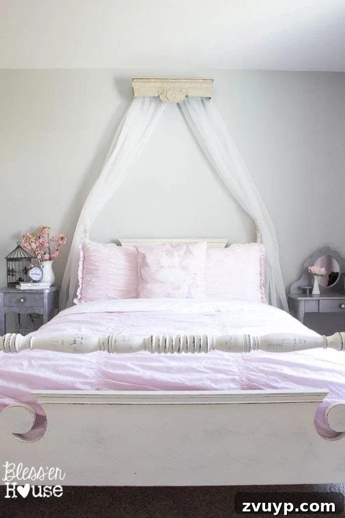 Dreamy Bed Canopy Crown from an Upcycled Shelf 6 DIY Canopy Crown from a Repurposed Shelf: Close-up of Olivia's bed with the new DIY canopy, highlighting the soft, flowing sheer curtains that create a princess feel.