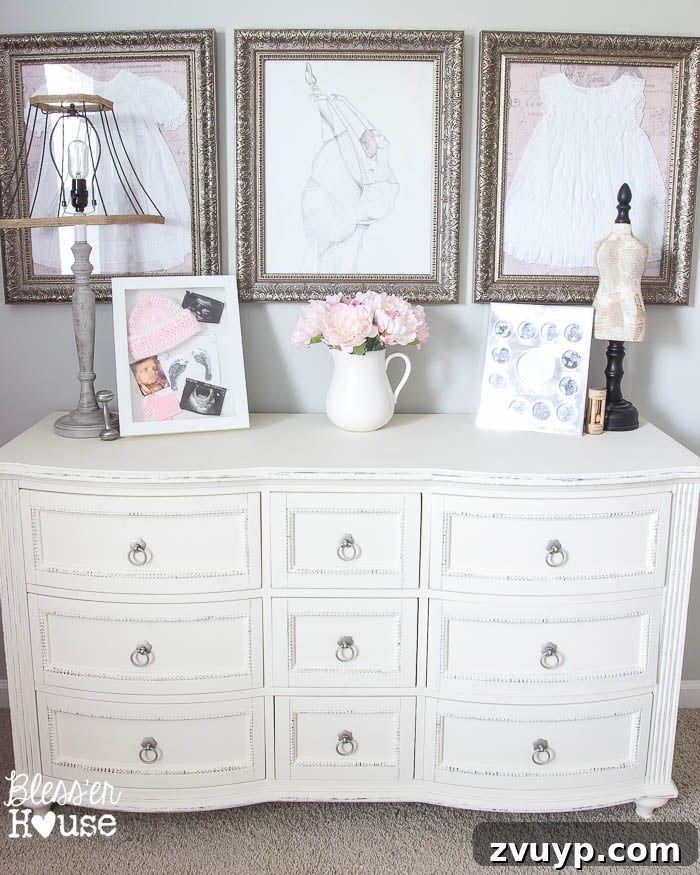 En Pointe Perfection: Her Ballerina Bedroom Makeover 18 Repurposed dresser with framed baby dresses and custom sketch art, adding sentimental value to a girl's bedroom.