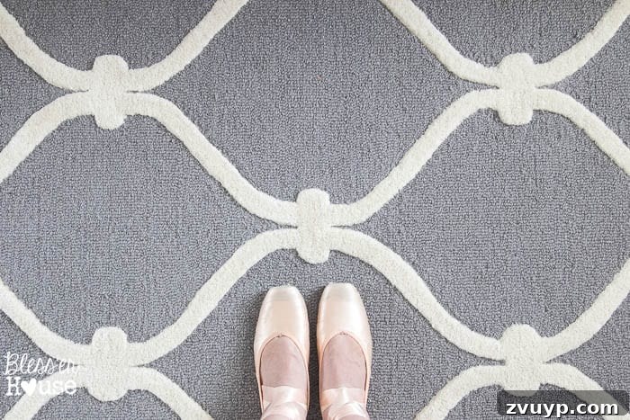 En Pointe Perfection: Her Ballerina Bedroom Makeover 30 Elegant area rug from Overstock.com in a ballerina bedroom, with adult feet demonstrating 'tippy toes'.