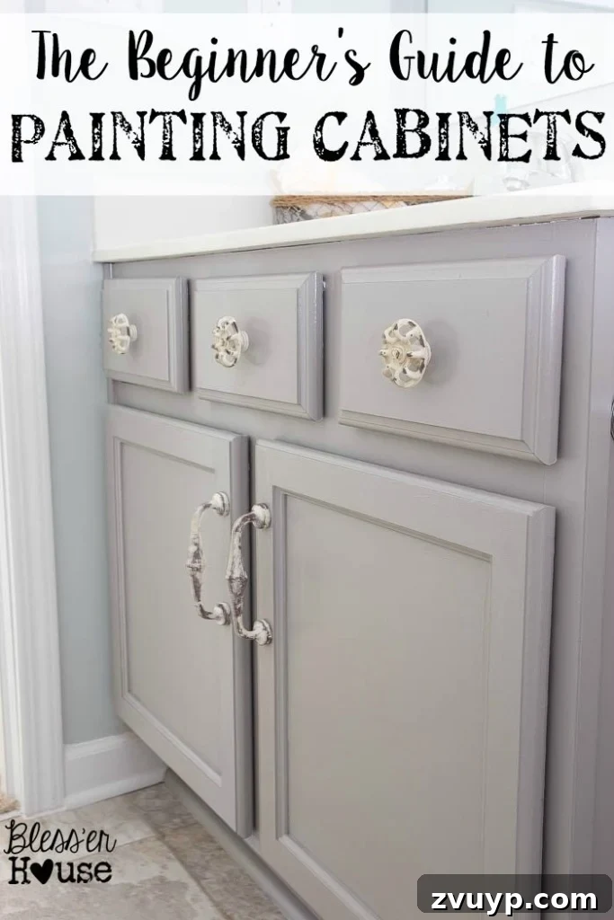 Effortless Cabinet Transformation for Beginners 2 Beautifully painted bathroom cabinets in a light grey color, showcasing a professional finish after a DIY project.