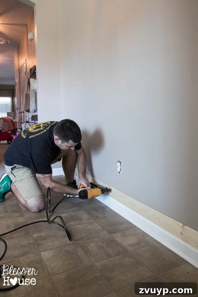 DIY Faux Shiplap Wall for Instant Farmhouse Charm 7 DIY Faux Shiplap Wall installation in progress