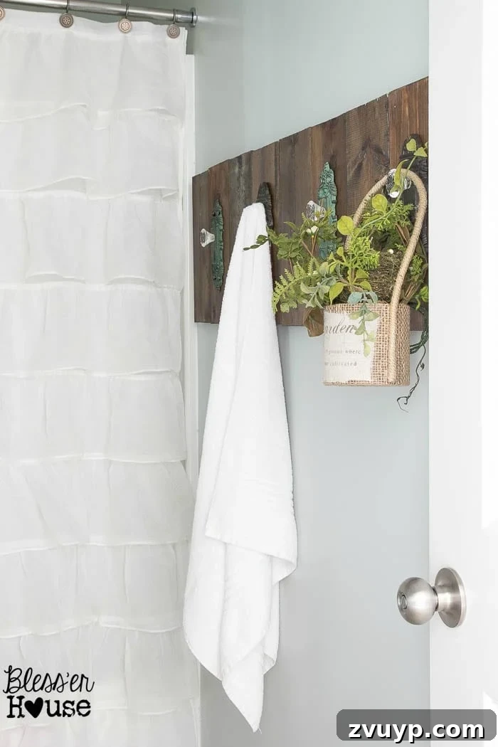 Upcycled Door Knob Towel Hooks 13 DIY Antique Door Knob Towel Rack | Bless'er House: A wider shot of the finished towel rack in the bathroom, highlighting its integration with the room's design.
