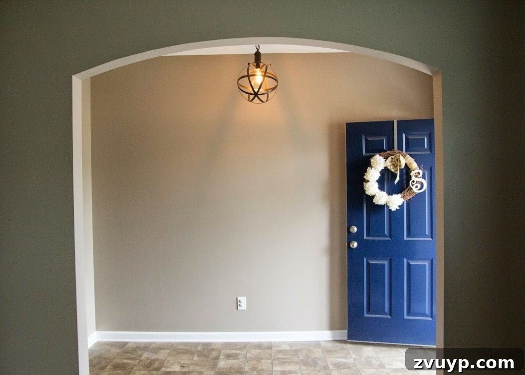 Foyer First Impressions: A Console Table's New Look 2 Dark, builder-grade foyer before modern farmhouse makeover