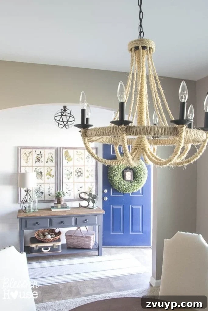 Foyer First Impressions: A Console Table's New Look 16 Modern Farmhouse Foyer Makeover: View from foyer into dining room with rope chandelier