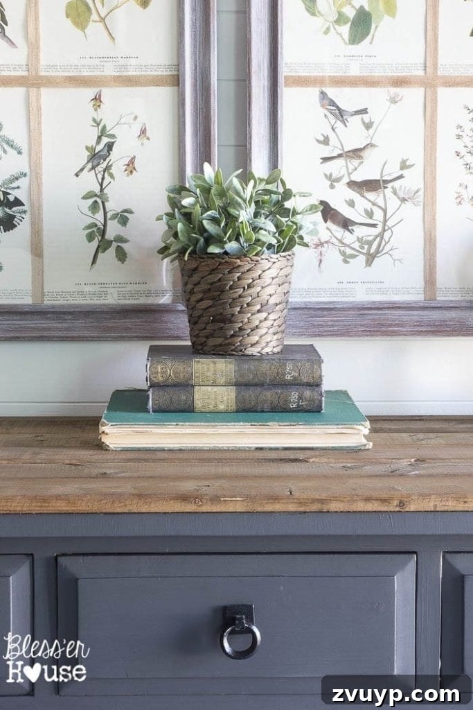 Foyer First Impressions: A Console Table's New Look 7 Modern Farmhouse Foyer Makeover: Stacked vintage books and decorative items