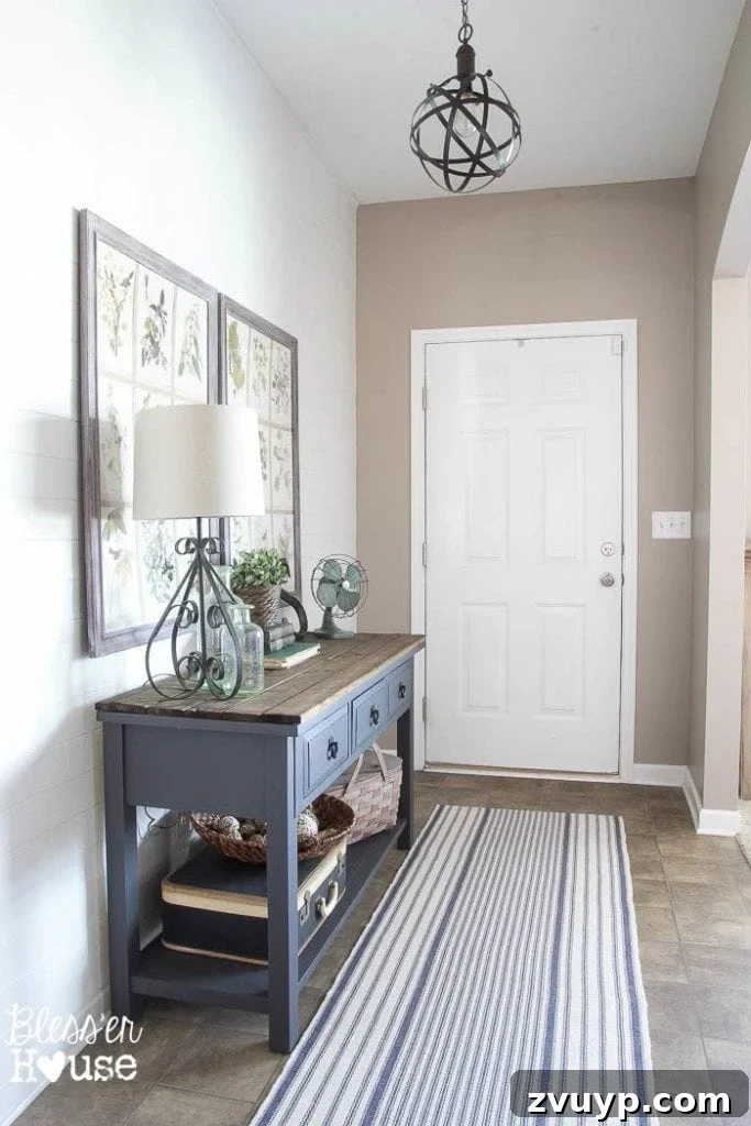 Effortless & Affordable Board and Batten DIY 3 Before shot of a plain foyer hallway before DIY board and batten installation