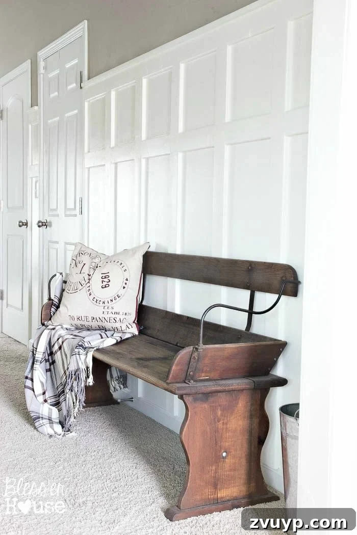 Effortless & Affordable Board and Batten DIY 6 Finished board and batten wainscoting with a small shelf in a stylish entryway