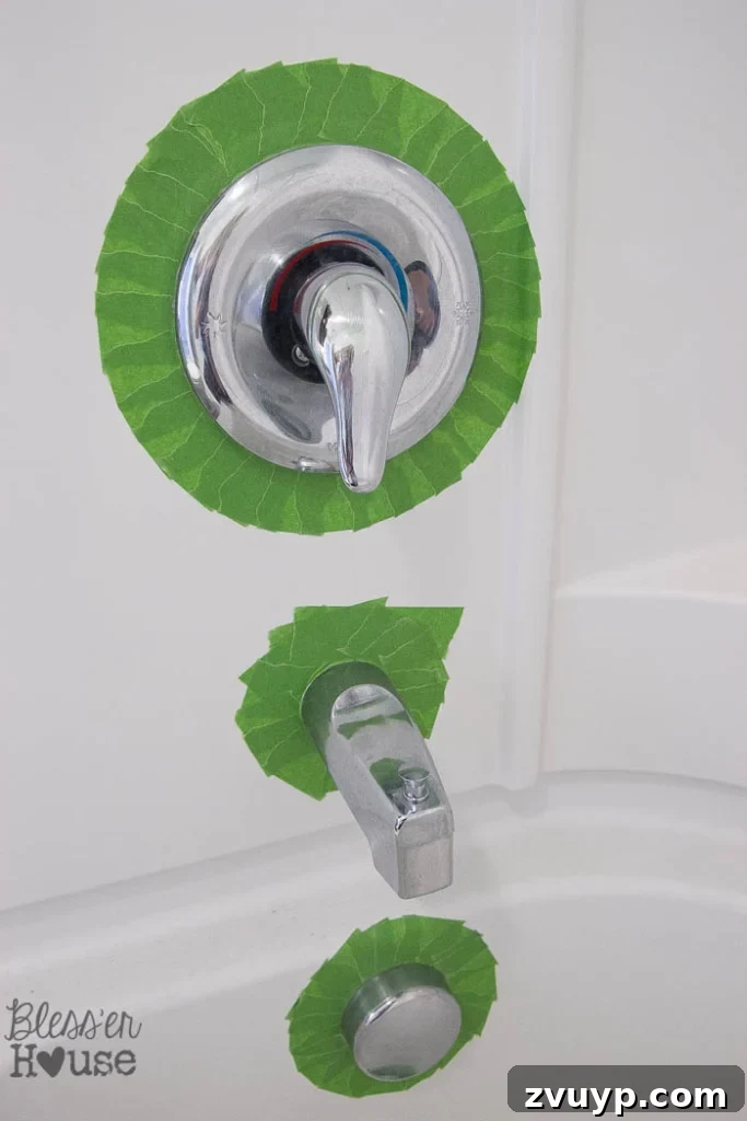 Transform Your Bathroom Fixtures with Spray Paint 6 painter's tape to spray paint faucet