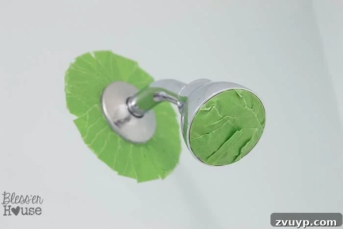 Transform Your Bathroom Fixtures with Spray Paint 7 painter's tape to spray paint a shower head