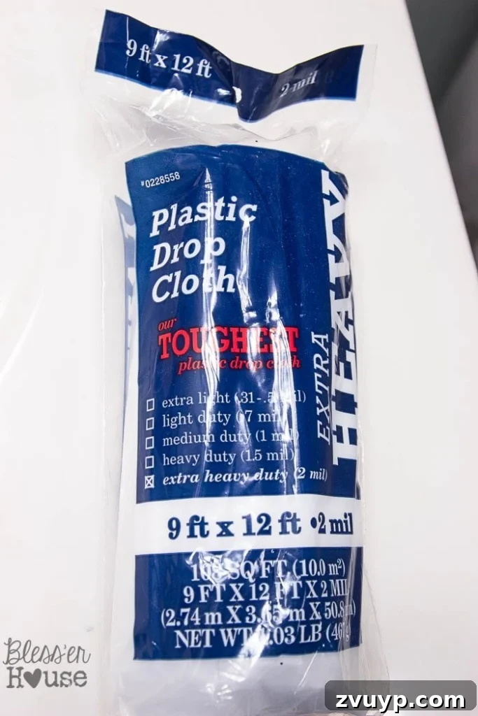Transform Your Bathroom Fixtures with Spray Paint 8 plastic drop cloth for spray painting shower fixtures