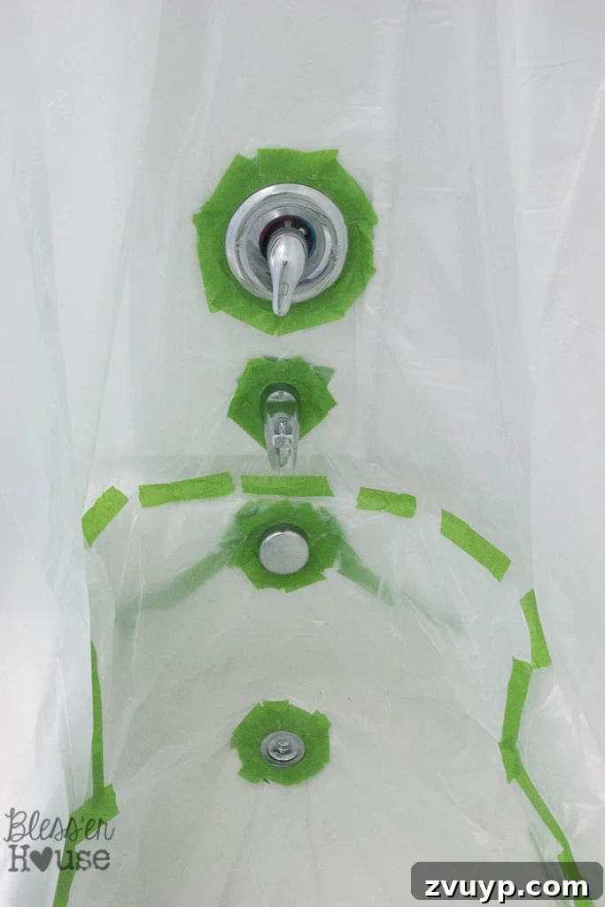 Transform Your Bathroom Fixtures with Spray Paint 9 taped drop cloth to spray paint shower fixtures