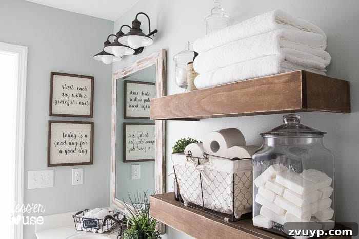 Chic Modern Farmhouse Bathroom Remodel Tour 17 Crisp white towels add a fresh, clean touch to the modern farmhouse bathroom decor.