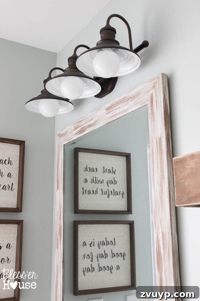 Chic Modern Farmhouse Bathroom Remodel Tour 18 Coordinated white towels and farmhouse decor elements create a serene atmosphere.