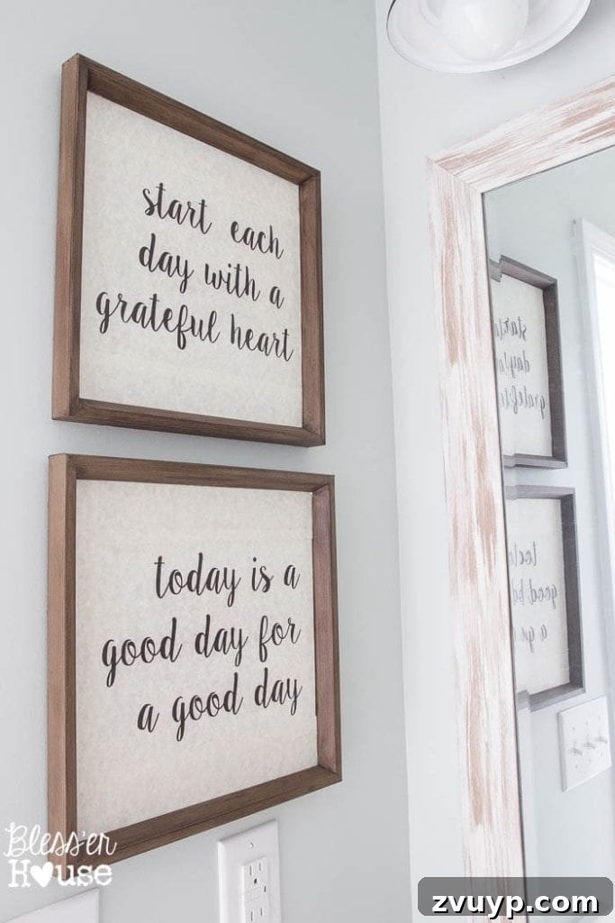 Chic Modern Farmhouse Bathroom Remodel Tour 19 DIY typography art created from thrift store finds, adding personalized and free decor to the bathroom.
