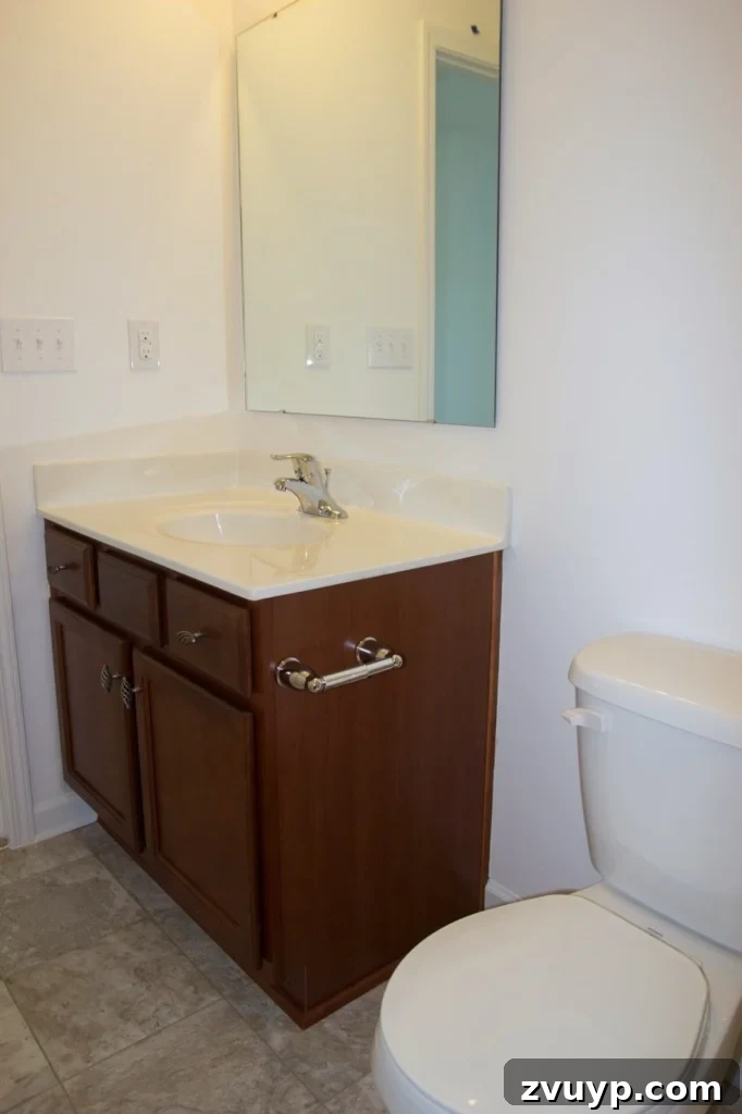Chic Modern Farmhouse Bathroom Remodel Tour 3 Before: Another view of the plain builder-grade bathroom, highlighting the need for a modern farmhouse makeover.