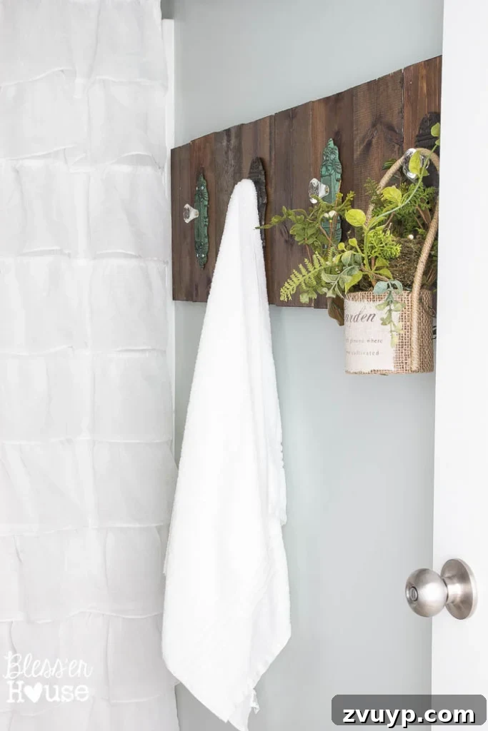Chic Modern Farmhouse Bathroom Remodel Tour 6 Details of the ruffled shower curtain, adding a soft, feminine touch to the modern farmhouse bathroom.