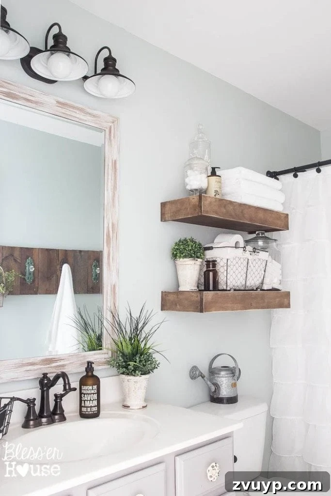 Chic Modern Farmhouse Bathroom Remodel Tour 7 Handmade towel rack crafted from scrap wood and antique doorknob hooks, a perfect DIY for a farmhouse bathroom.
