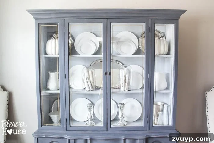 French Provincial Elegance Renewed 9 Interior of the china cabinet painted in Sterling, displaying vintage silver