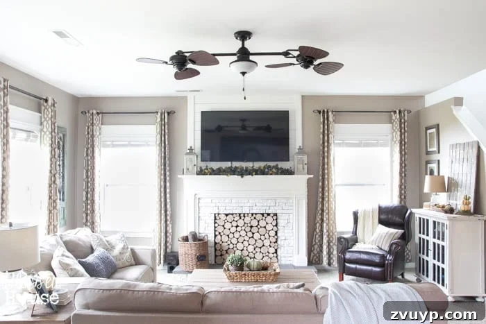 The Budget Hack for Designer Paint Colors 12 Open concept living space with Sherwin Williams Perfect Greige walls.