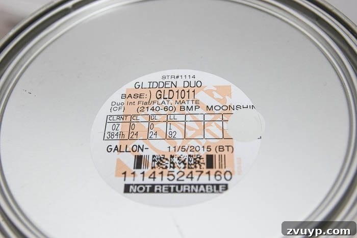 The Budget Hack for Designer Paint Colors 4 Close-up of a paint can label showing Glidden paint mixed in Benjamin Moore 'Moonshine' color.