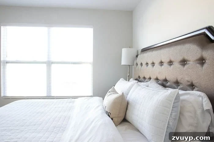 The Budget Hack for Designer Paint Colors 8 Master bedroom with walls painted in Benjamin Moore Moonshine.