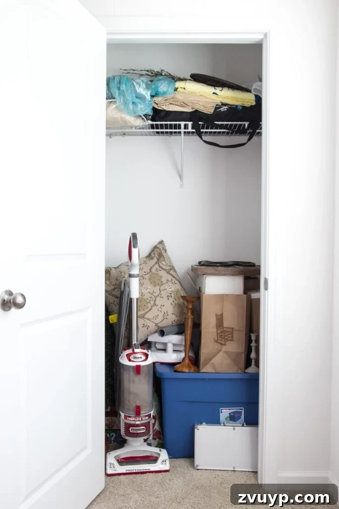 Quick and Easy DIY Closet Shelves 3 Before shot of a cluttered closet, showing the need for basic DIY closet shelving. This beginner home improvement project will replace the wire shelves.