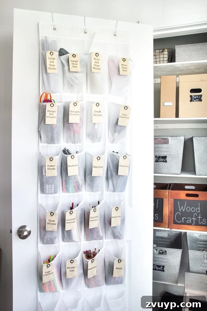 Your Ultimate Craft Closet Makeover 7 Over-the-door shoe organizer repurposed for craft supply storage, labeled for easy access.