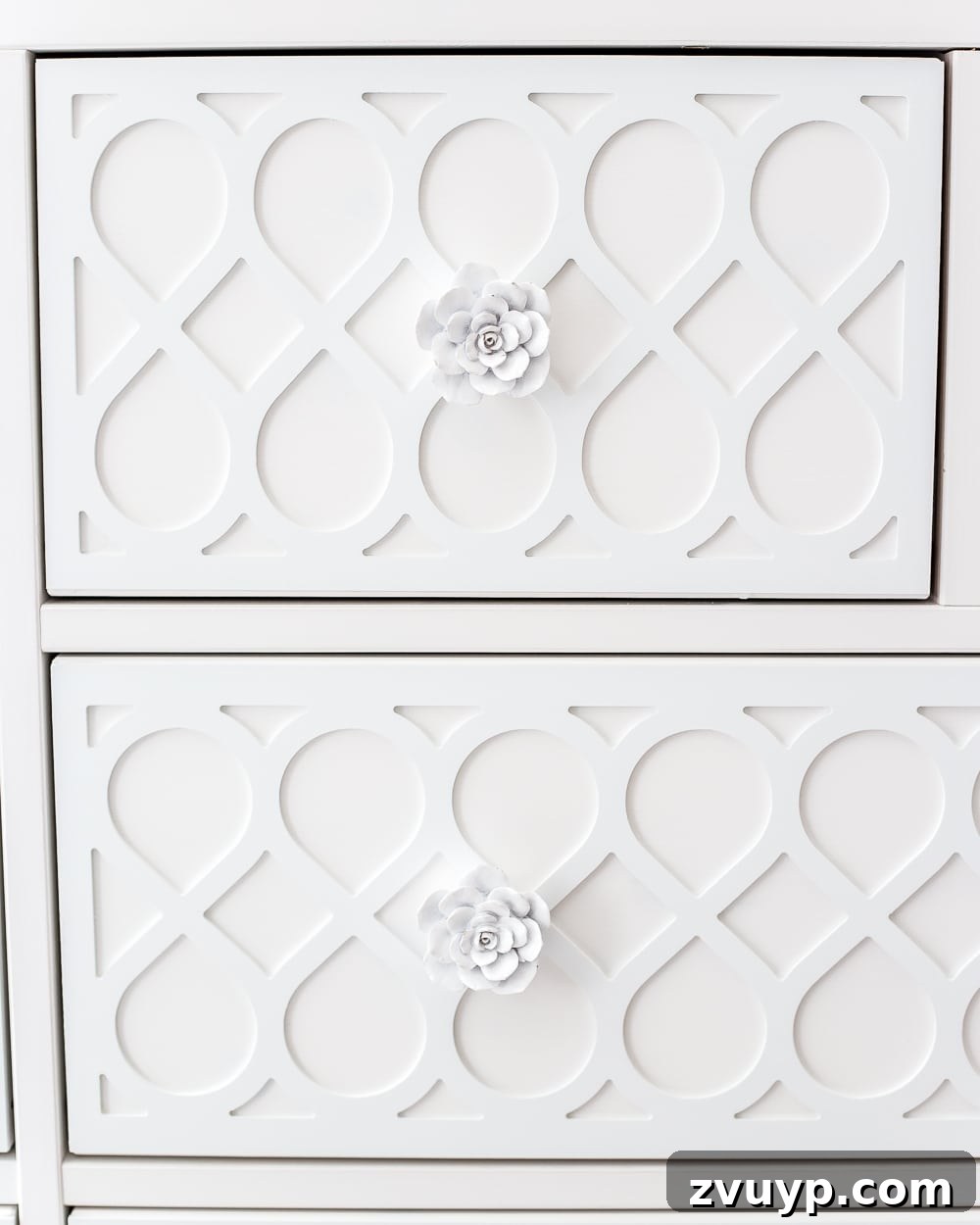 white rose drawer knobs on white applique drawer fronts