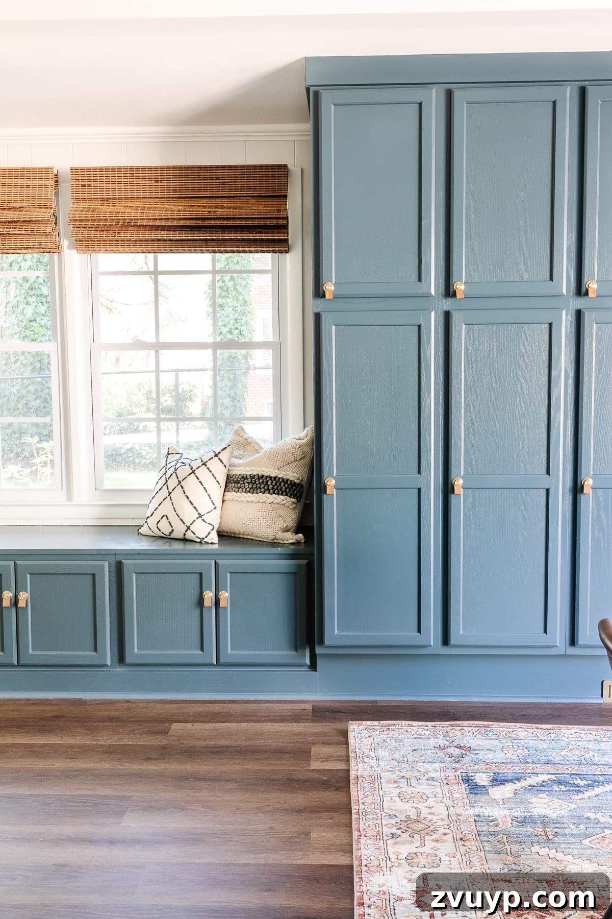 leather cabinet pulls in a playroom with window seat