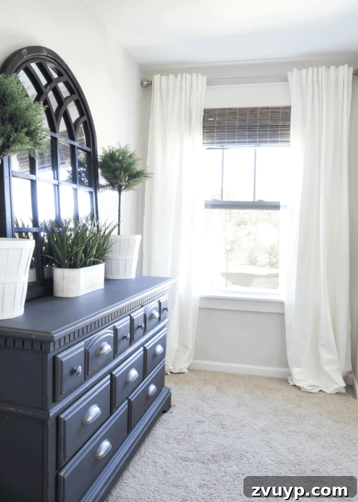 From Basic to Brilliant: 3 Windows Upgrade Secrets 9 Bedroom view with mirror reflecting natural light from the updated windows