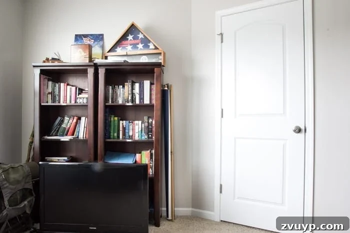 Cluttered home office bookshelf before DIY French mute book makeover