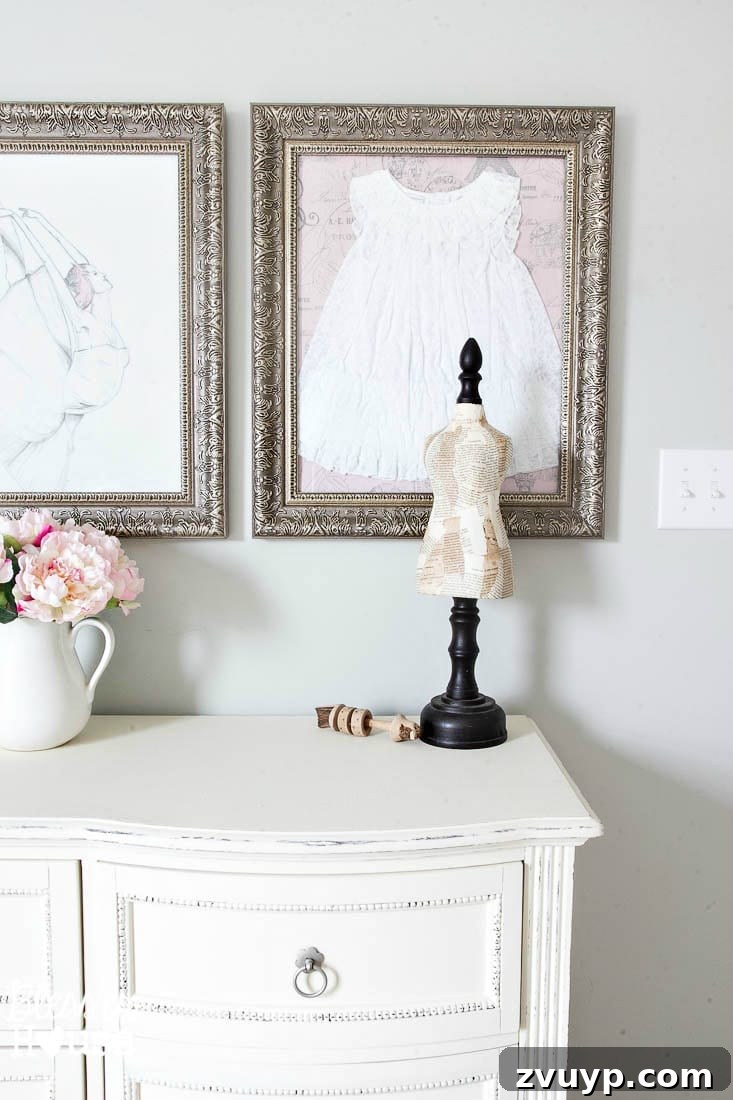 18 Ingenious DIY Wall Decor on a Budget 3 Framing a baby's dress as heartfelt DIY wall decor in a nursery