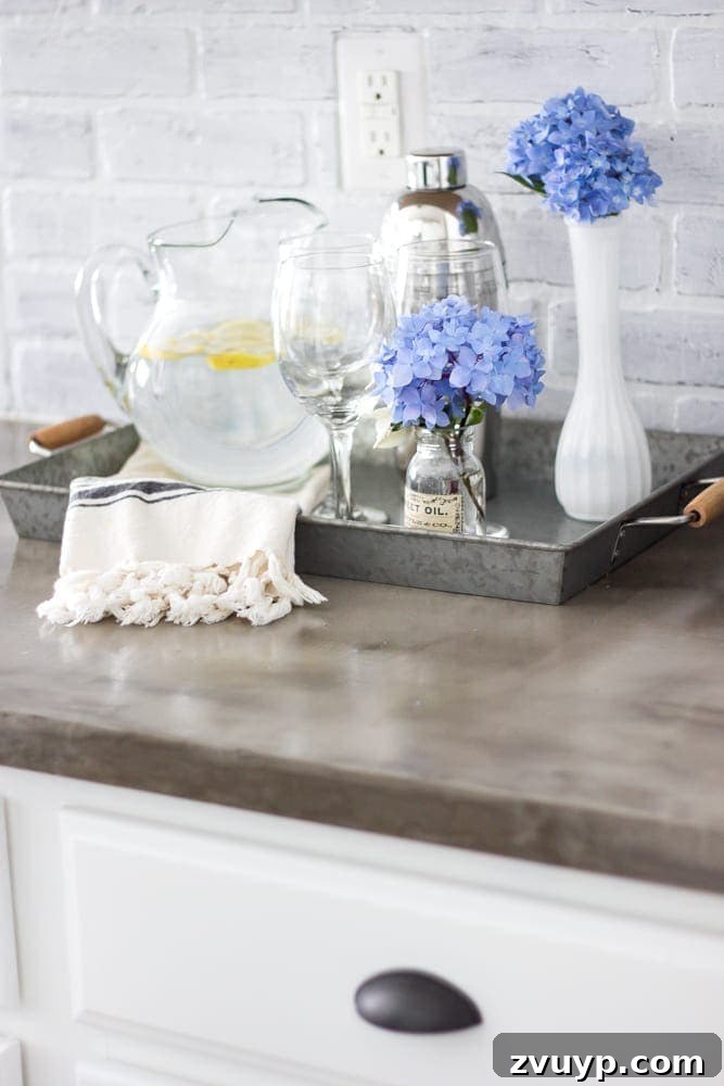 Flawless Cabinets: Paint Your Kitchen Like a Seasoned Pro 14 Newly painted white kitchen cabinets reflecting light, making the space feel open and bright. Durable DIY cabinet painting guide.