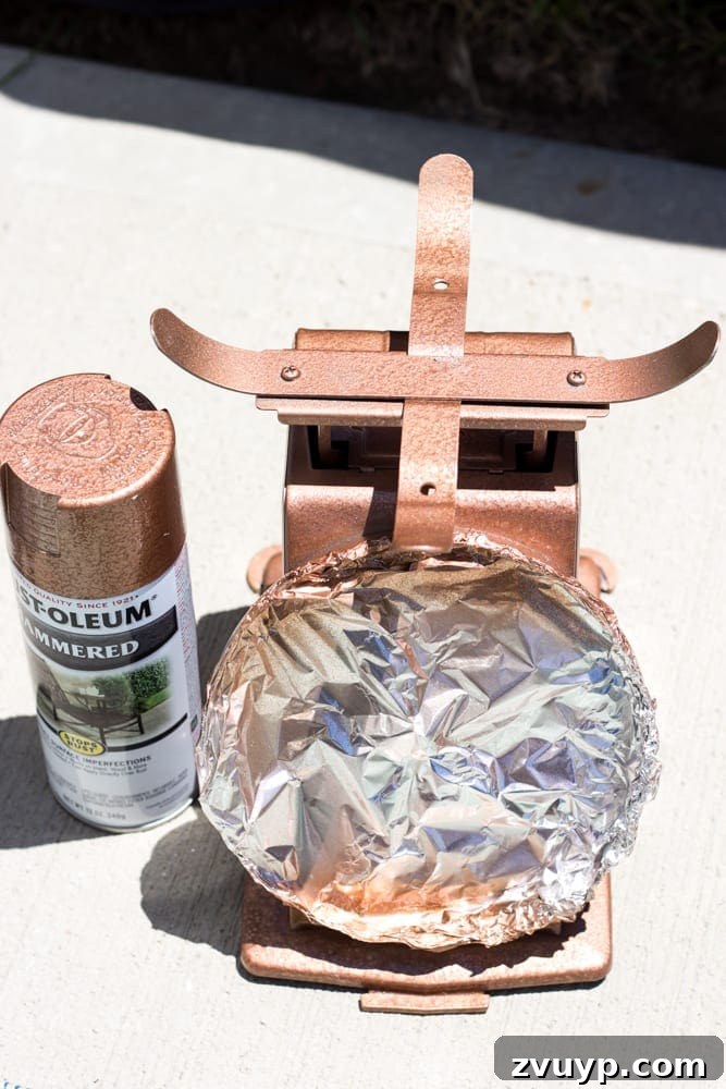 Rustic Revival: Faux Rust Vintage Scale 5 Faux Rusted Vintage Scale Makeover: Applying copper spray paint as the base layer.