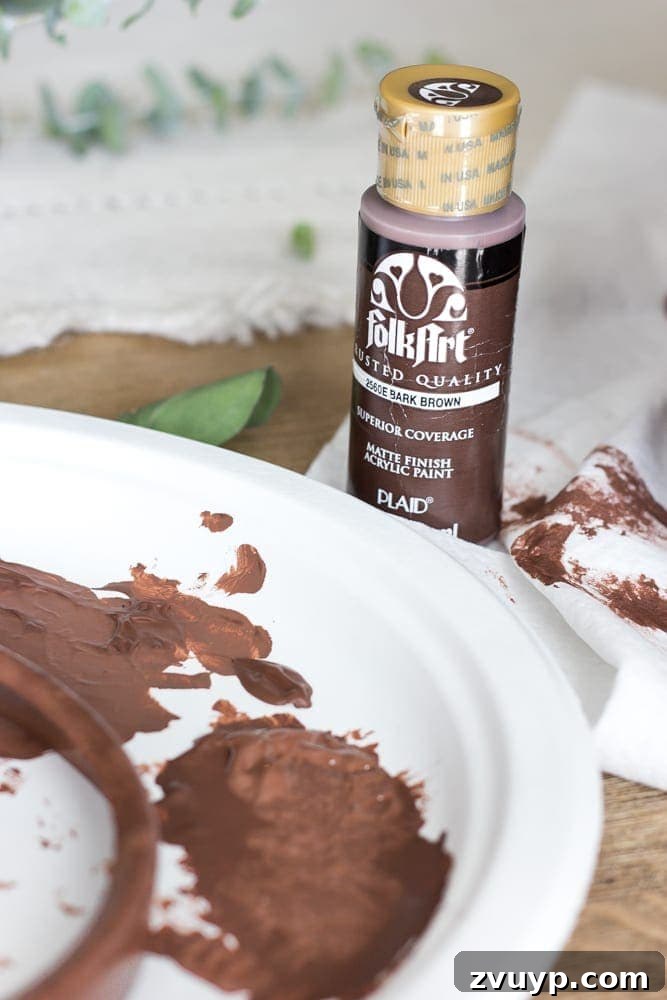 Rustic Revival: Faux Rust Vintage Scale 6 Faux Rusted Vintage Scale Makeover: Dabbing bark brown acrylic paint for the first rust layer.