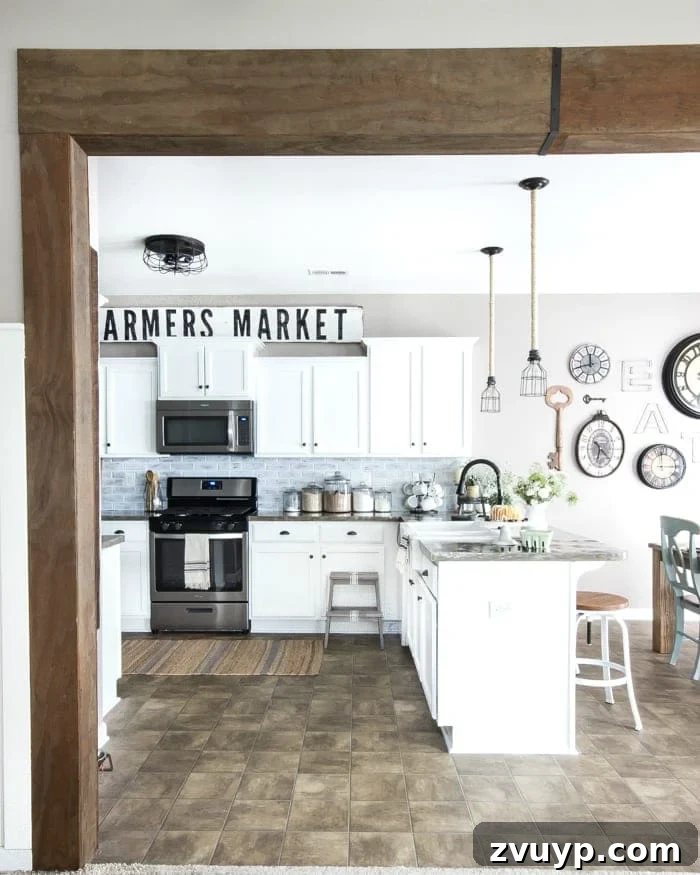 Our Stunning Modern Farmhouse Kitchen Transformation 16 The DIY wood beam doorway, connecting the kitchen and living room, adding a rustic architectural element to the farmhouse design.