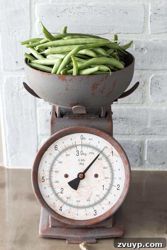Our Stunning Modern Farmhouse Kitchen Transformation 18 A vintage-style food scale, lovingly restored with a faux rusted finish, proudly displaying fresh produce from the garden.