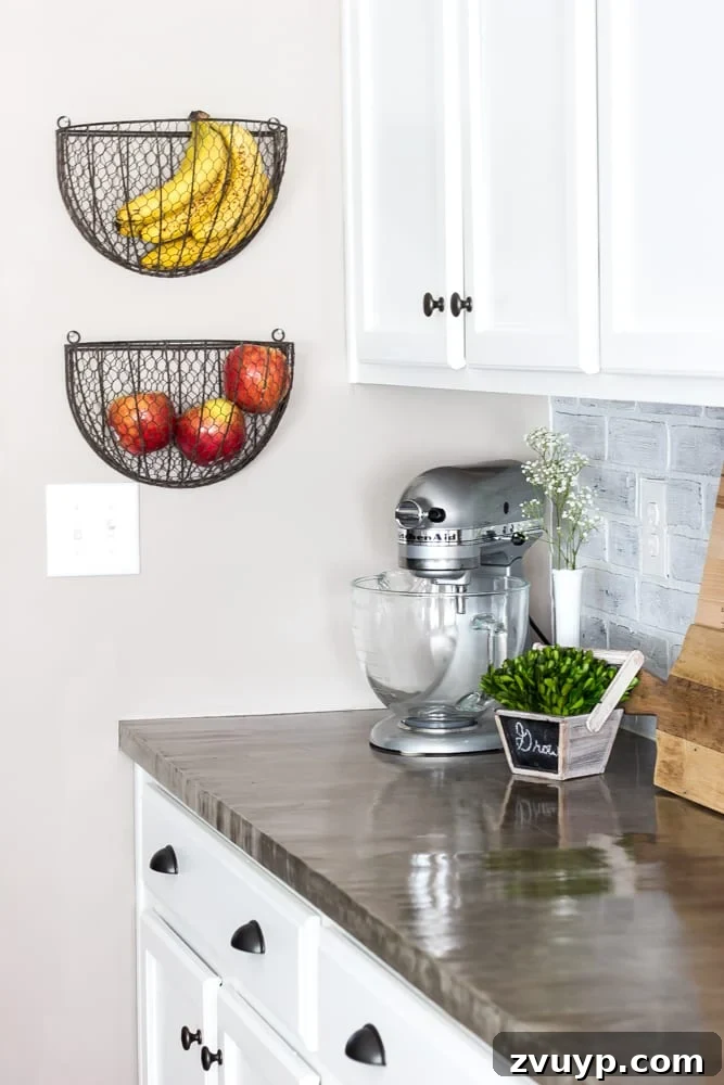 Our Stunning Modern Farmhouse Kitchen Transformation 21 Wall planter baskets repurposed as stylish and practical storage for fruits and vegetables, enhancing the kitchen's farmhouse appeal.