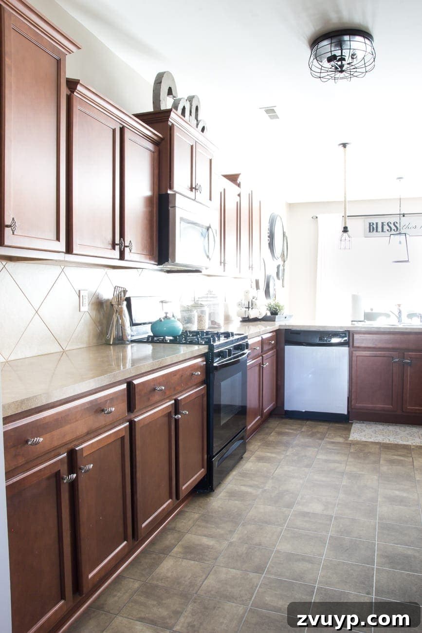 Our Stunning Modern Farmhouse Kitchen Transformation 9 The kitchen's original black gas range, a placeholder before the stylish and functional stainless steel upgrade.